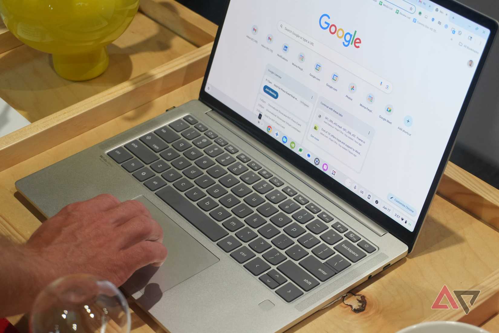 The Lenovo Chromebook Plus 14 with Google Chrome open to the start page.