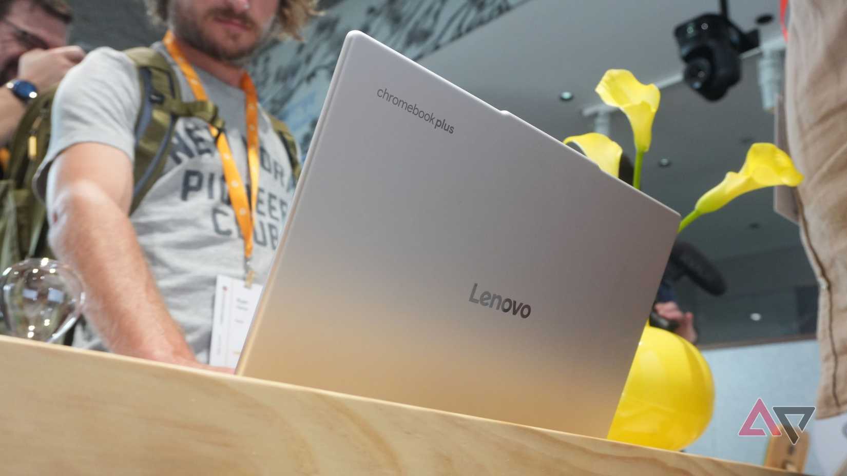Lenovo Chromebook Plus 14 on table while being demoed by others