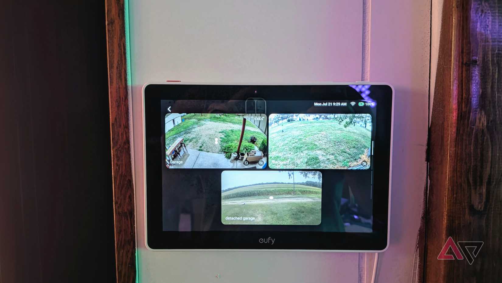 The wall-mounted Eufy Smart Display E10 displays three camera feeds.