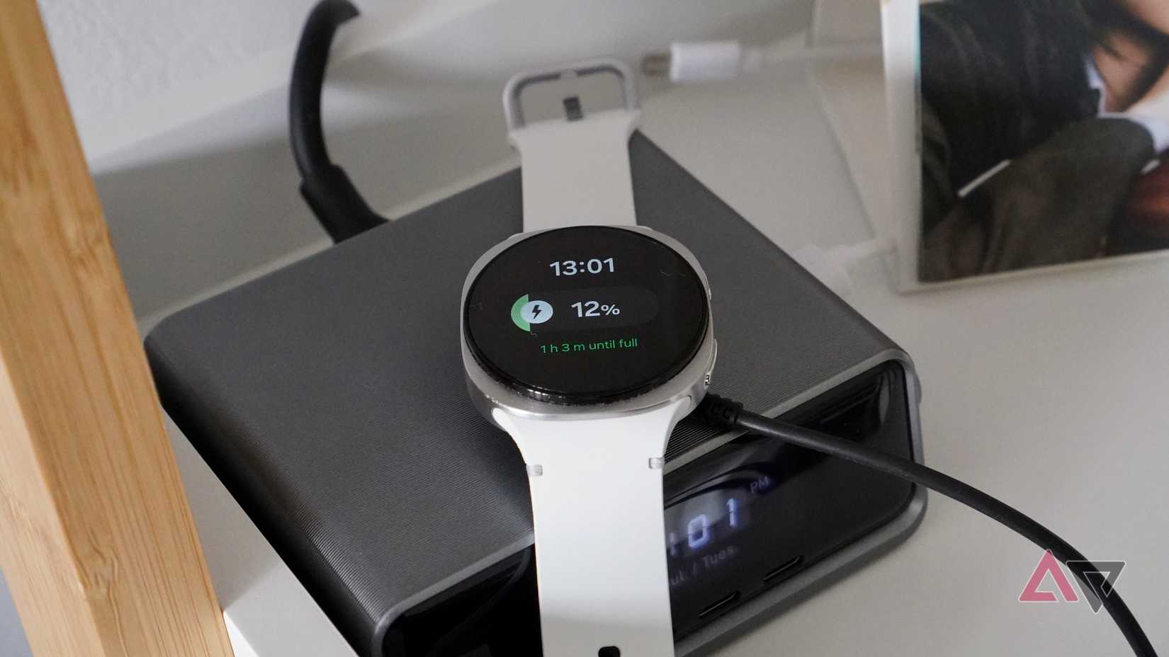 The Samsung Galaxy Watch 8 on its charging puck