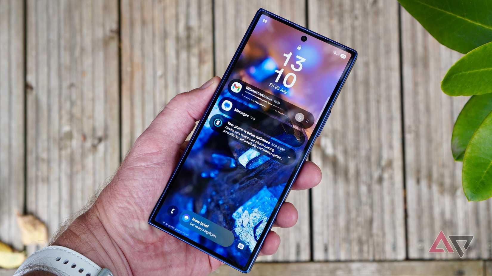 holding up the Galaxy Z Fold 7 front showing the notification cards on a lock screen