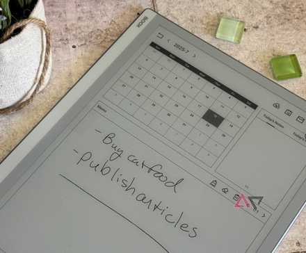 Onyx Boox Go 10.3 surrounded by green glass beads