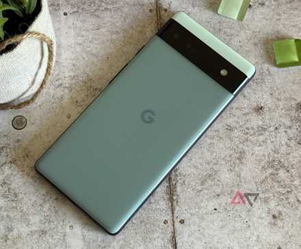 Google Pixel 6a surrounded by green beads