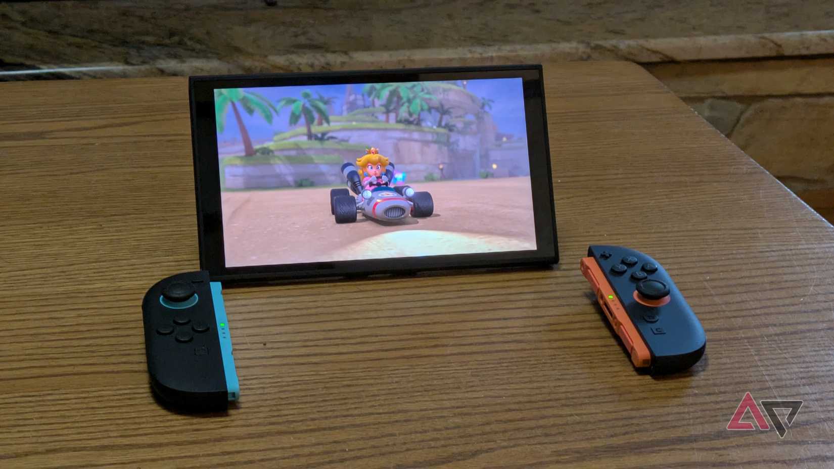 A Switch 2 in tabletop mode with Joy-Con 2s on the table.