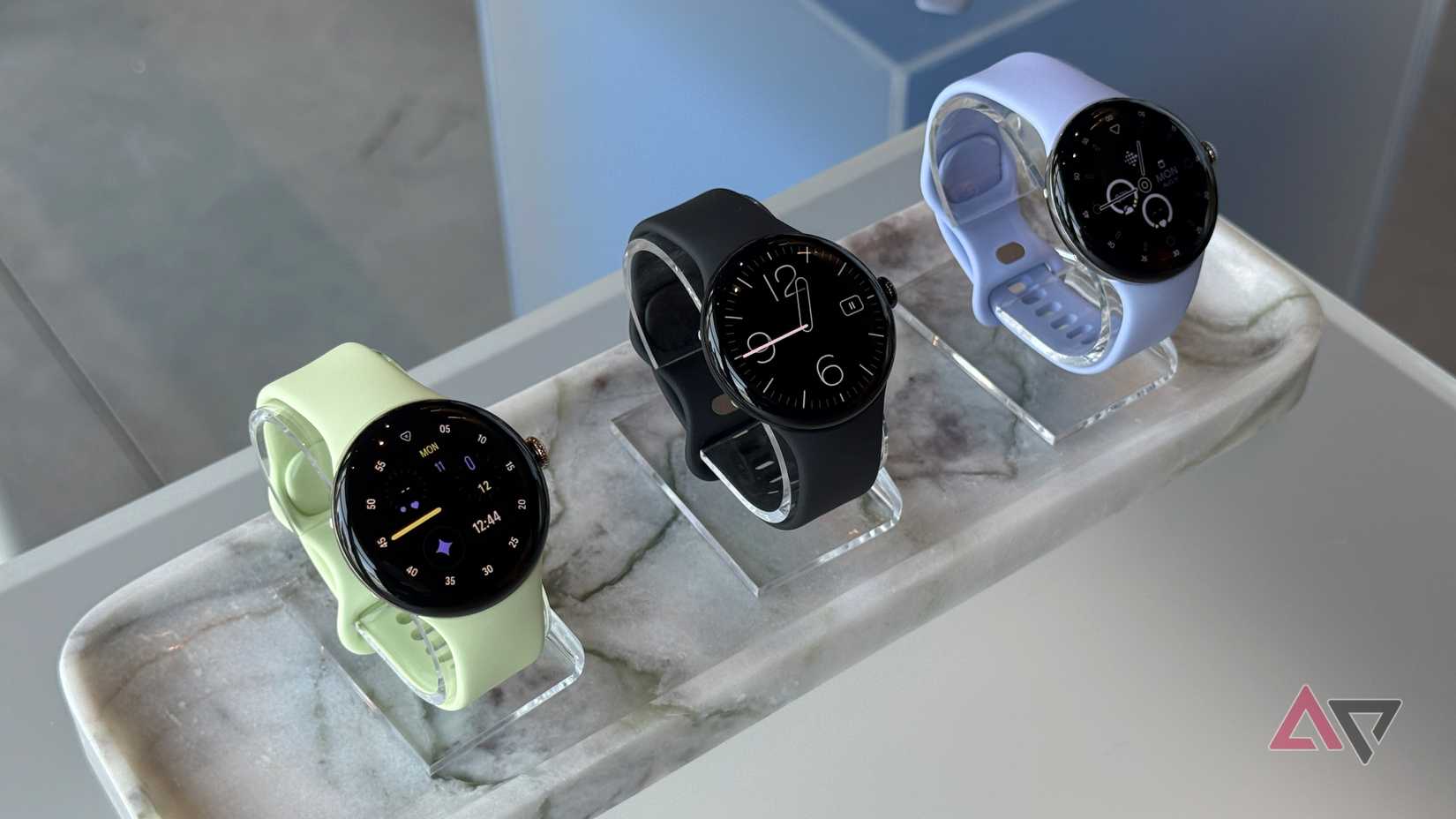 Google Pixel Watch 4 lineup on a marble slab