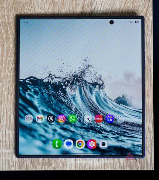 The Galaxy Z Fold 7 opened on a brown wooden table