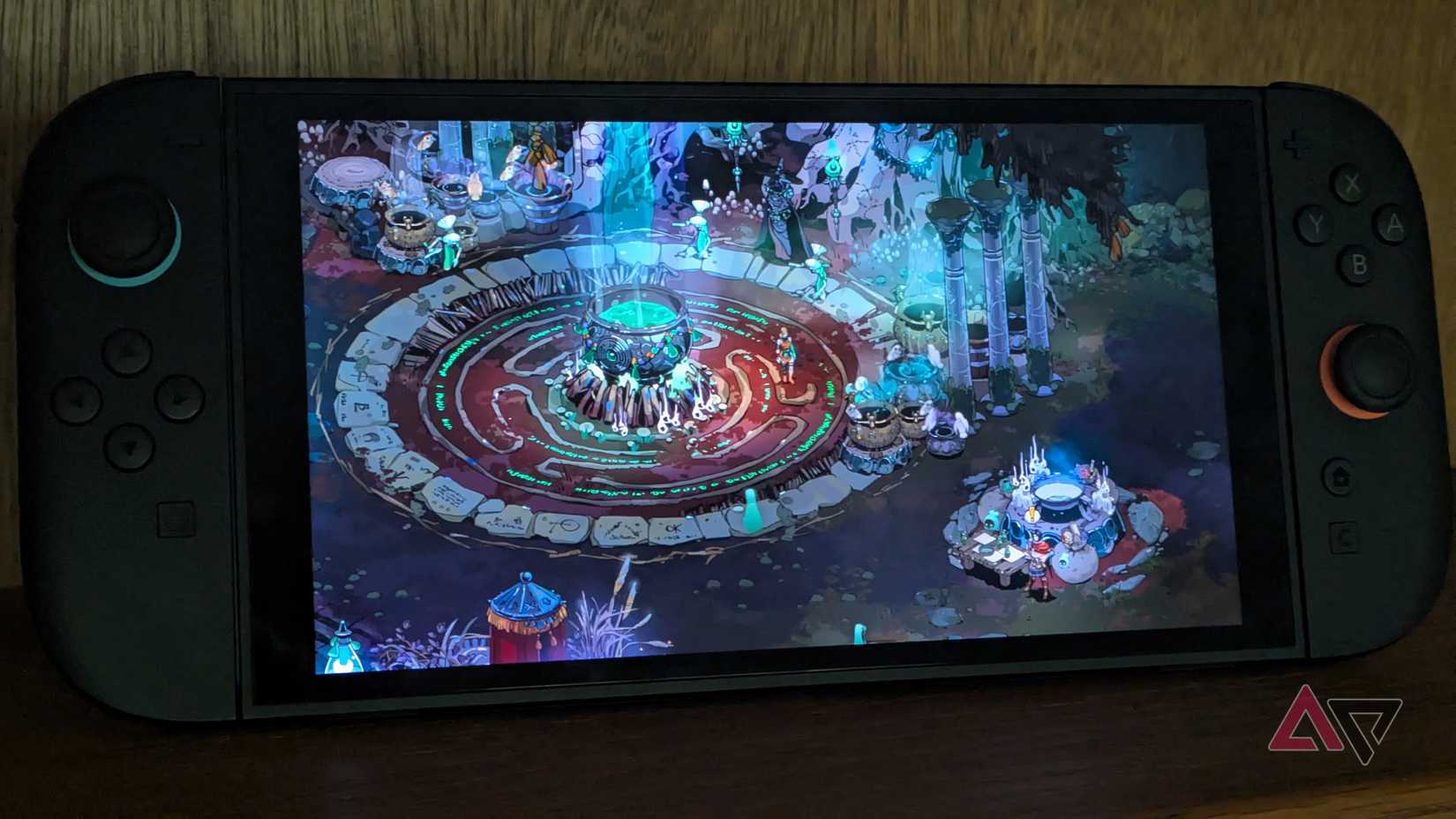 Hades 2 runs on a Nintendo Switch 2 sitting on a shelf in tabletop mode.