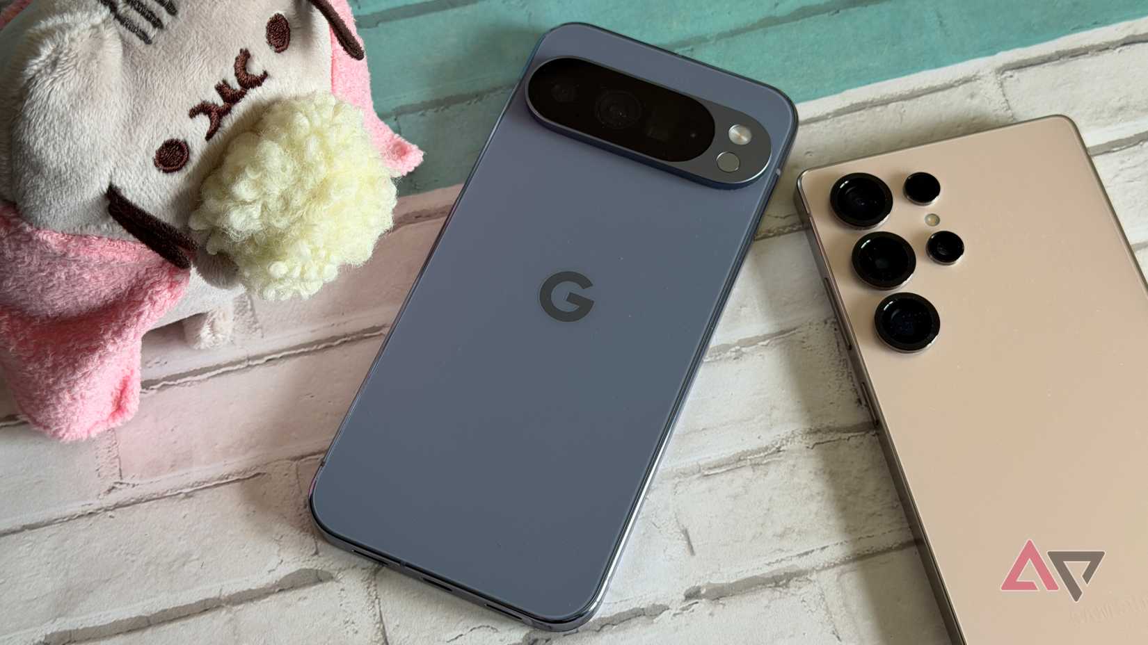 Google Pixel 10 Pro XL next to a Galaxy S25 Ultra and pusheen