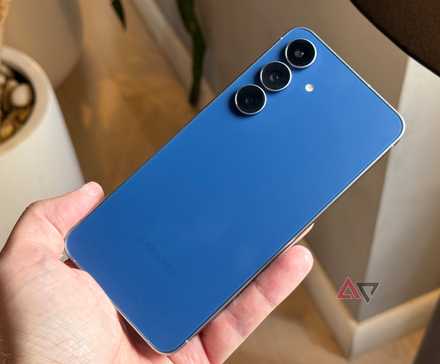 Samsung Galaxy S25 FE held against a lamp