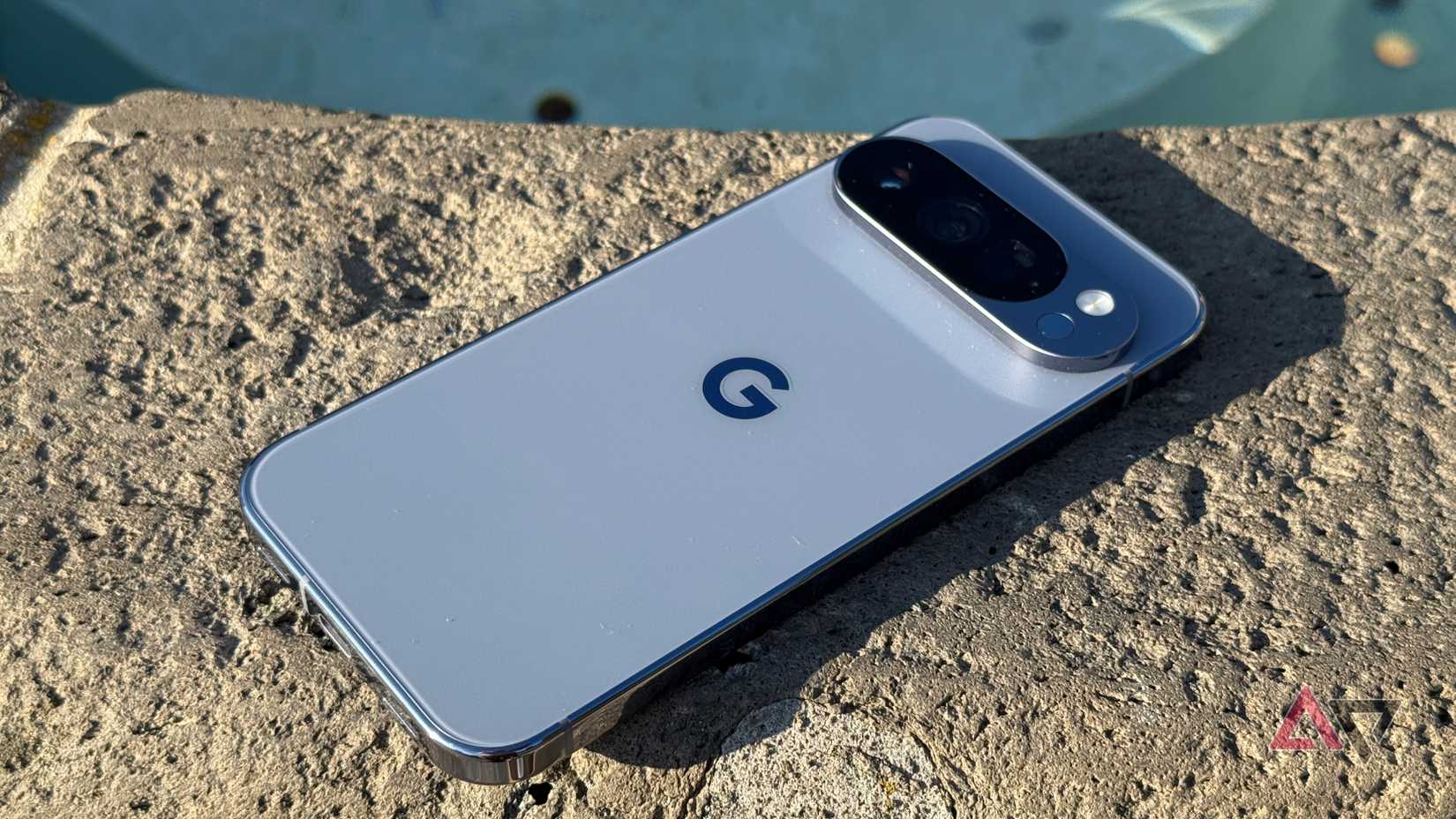 Google Pixel 10 Pro sitting on a fountain