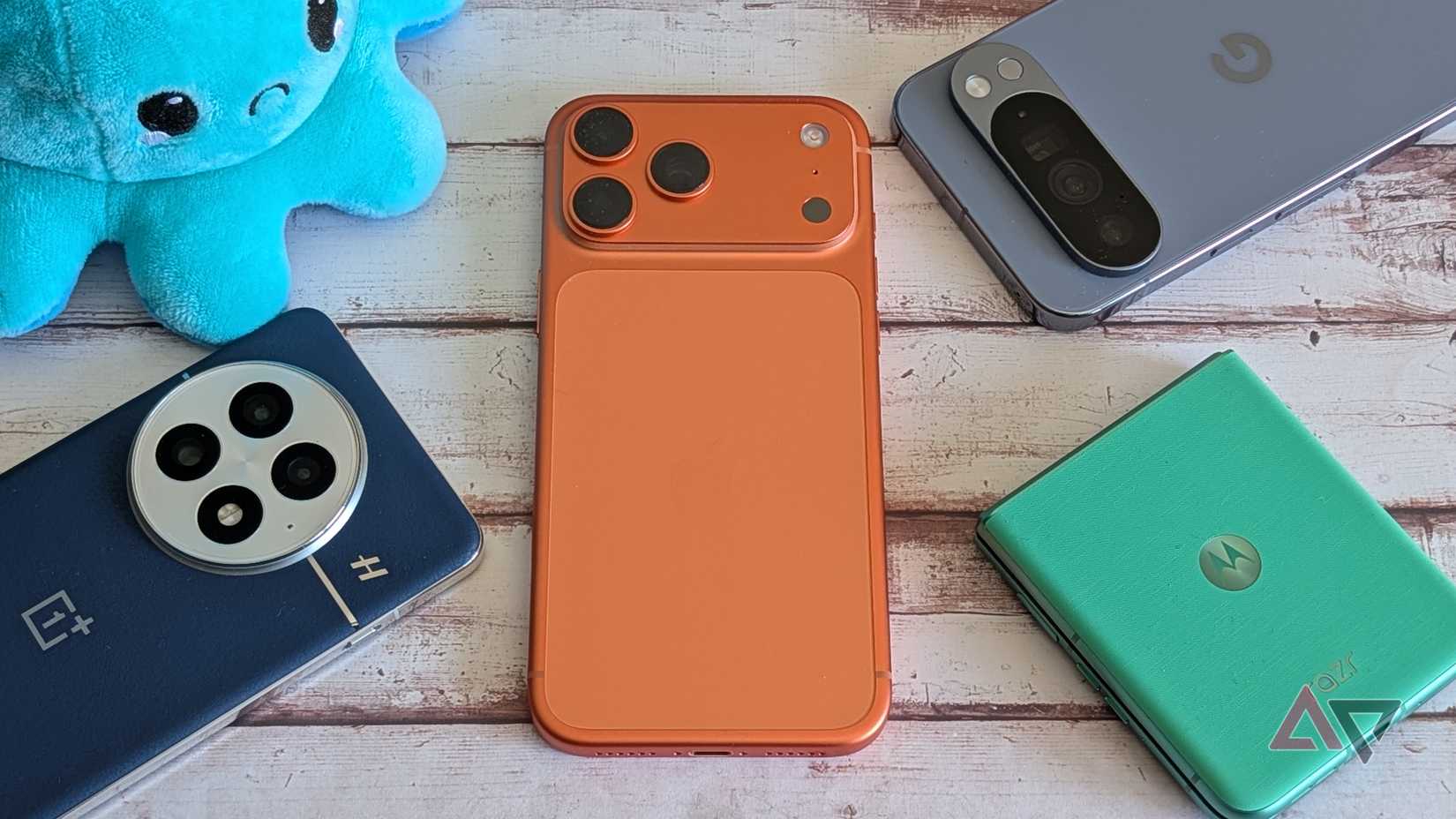 Apple iPhone 17 Pro Max surrounded by Android phones