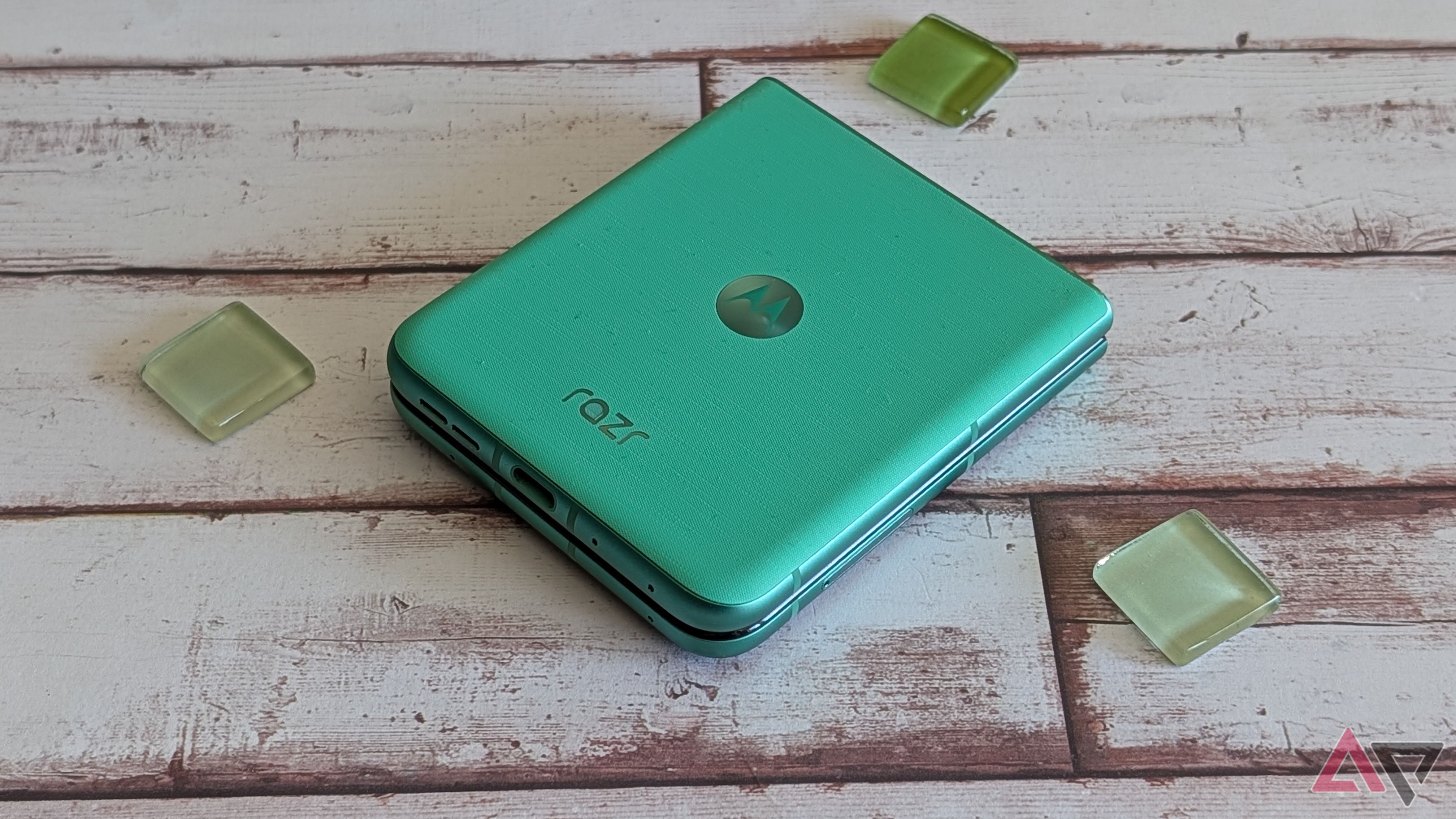 Motorola Razr 2025 surrounded by green beads