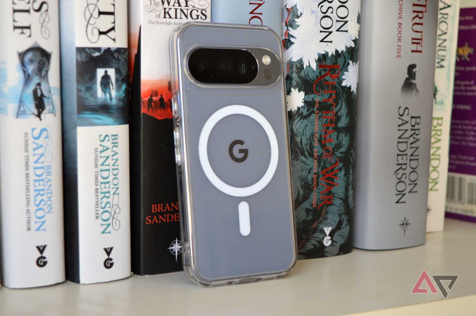 The Spigen Ultra Hybrid MagFit Pixel 10 Pro case on a bookcase, with an AP watermark.
