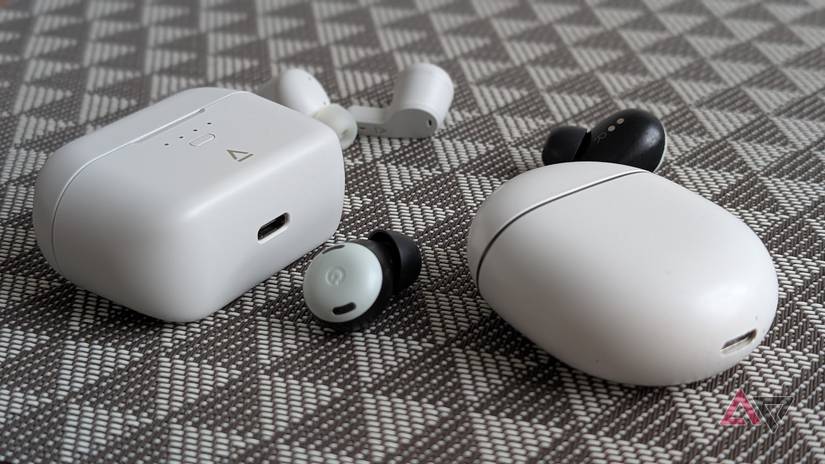 botões de pixel brancos e fones de ouvido criativos brancos na superfície preto e branco