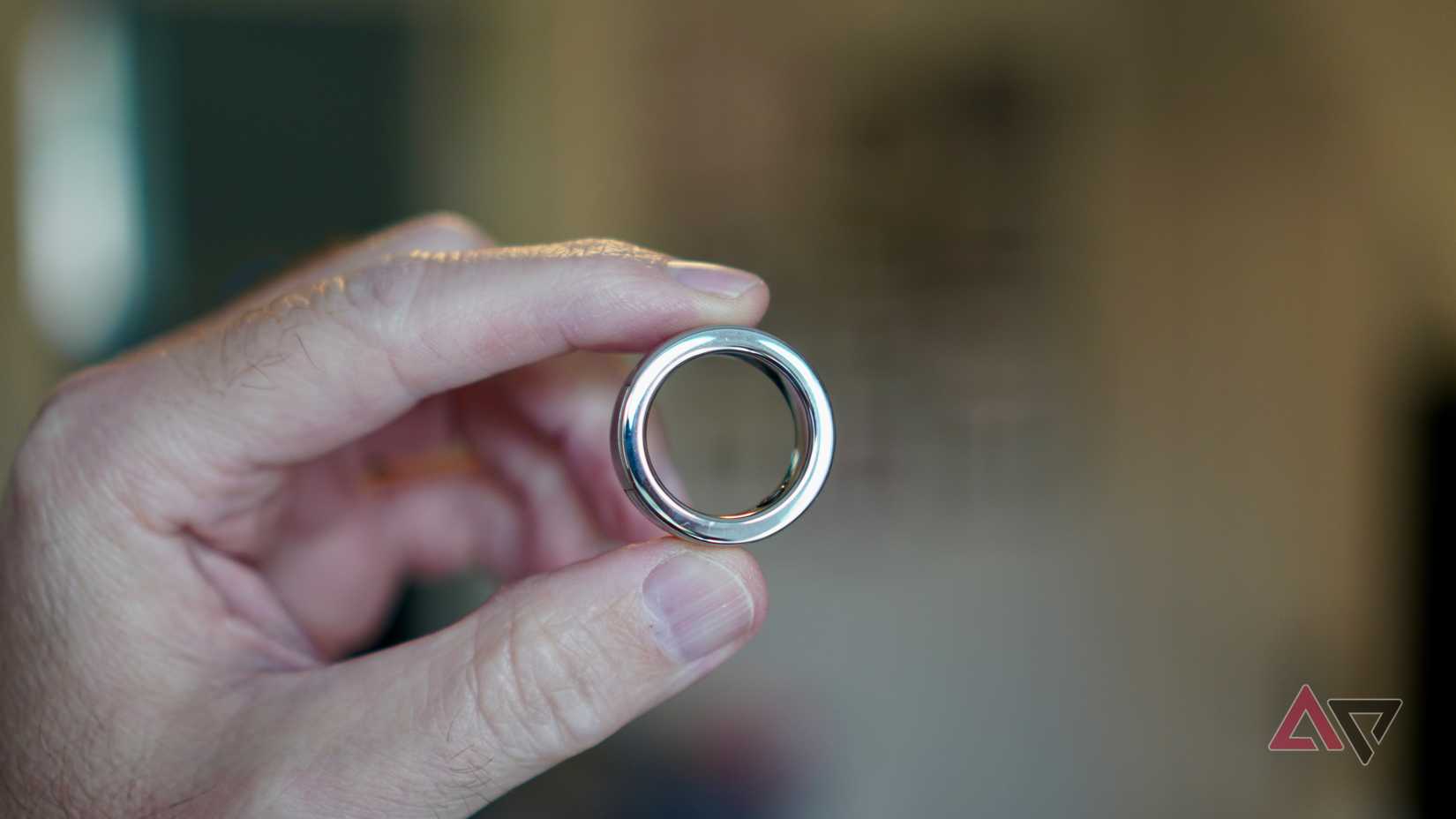 A person holding the Halliday Glasses's smart ring