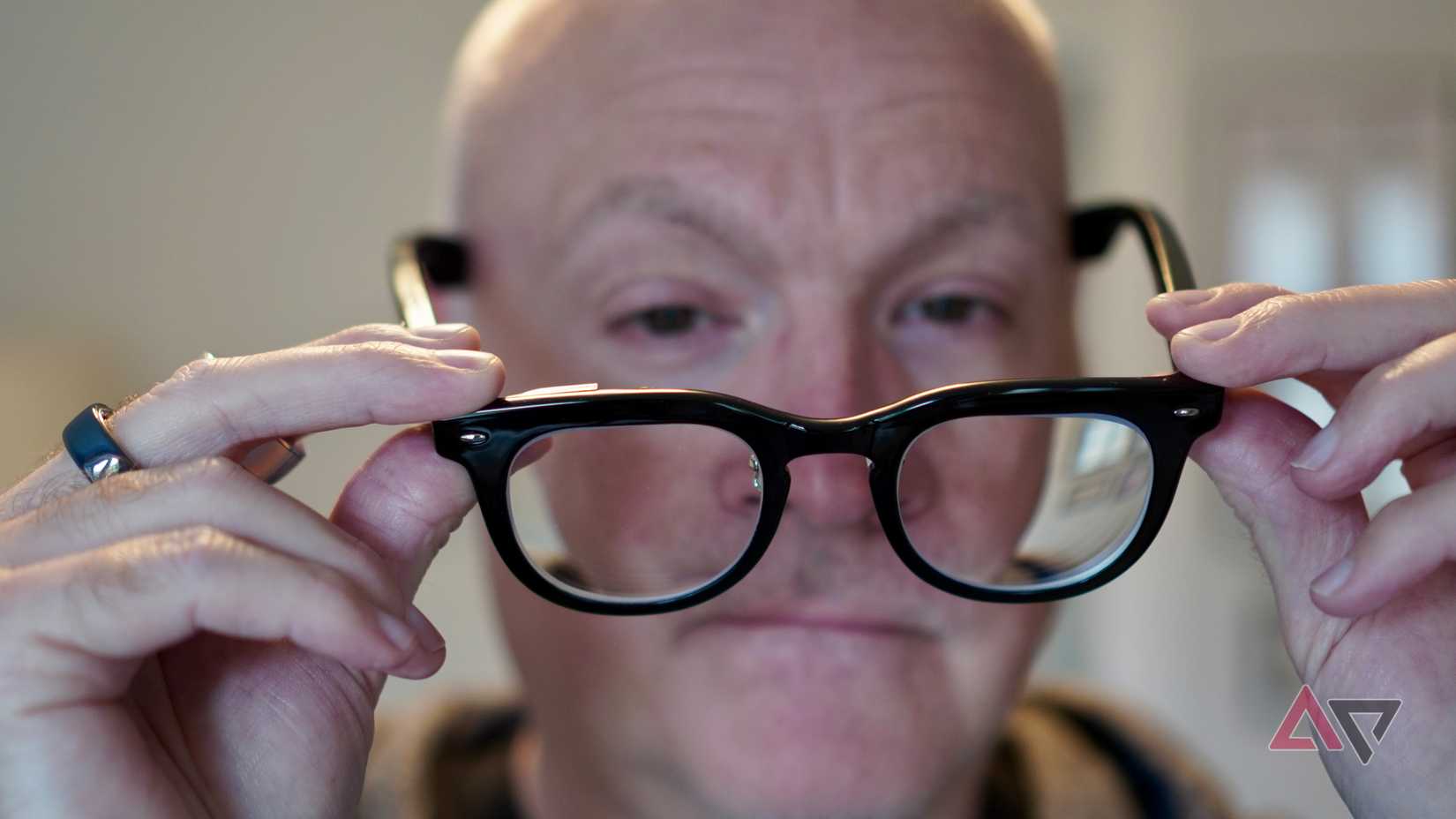 A person taking off the Halliday Glasses