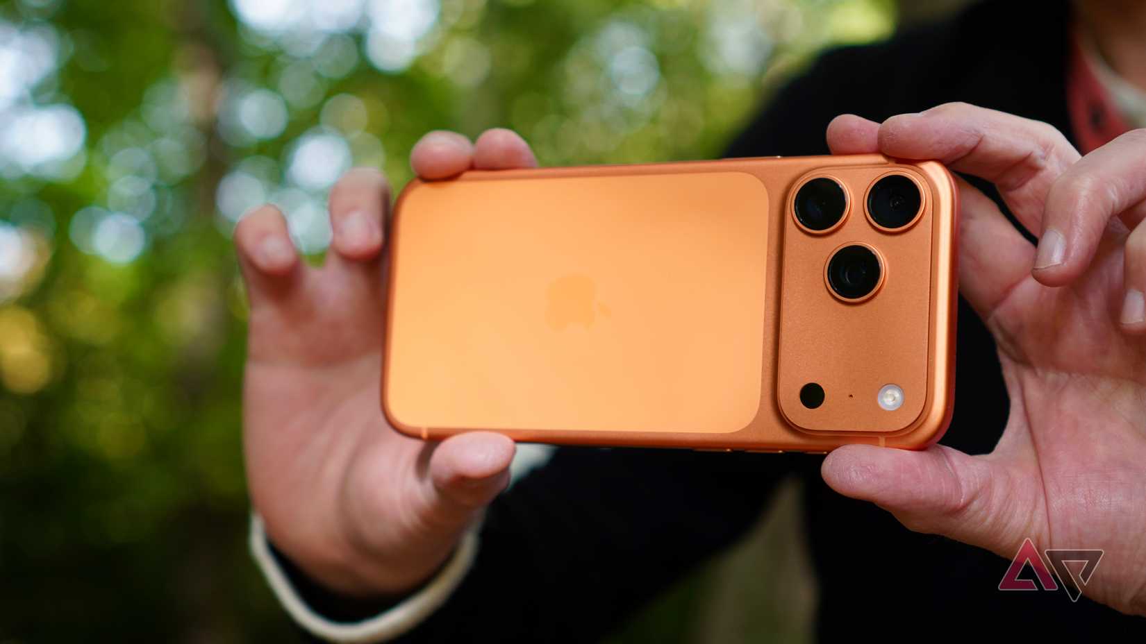 A person taking a photo with the Apple iPhone 17 Pro Max