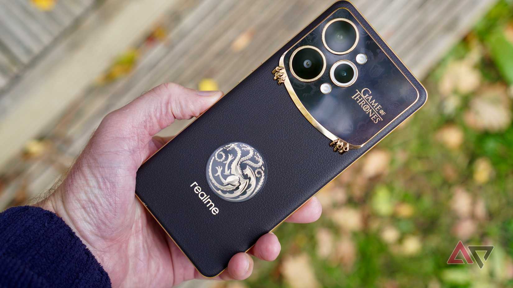 A person holding the Realme 15 Pro Game of Thrones phone