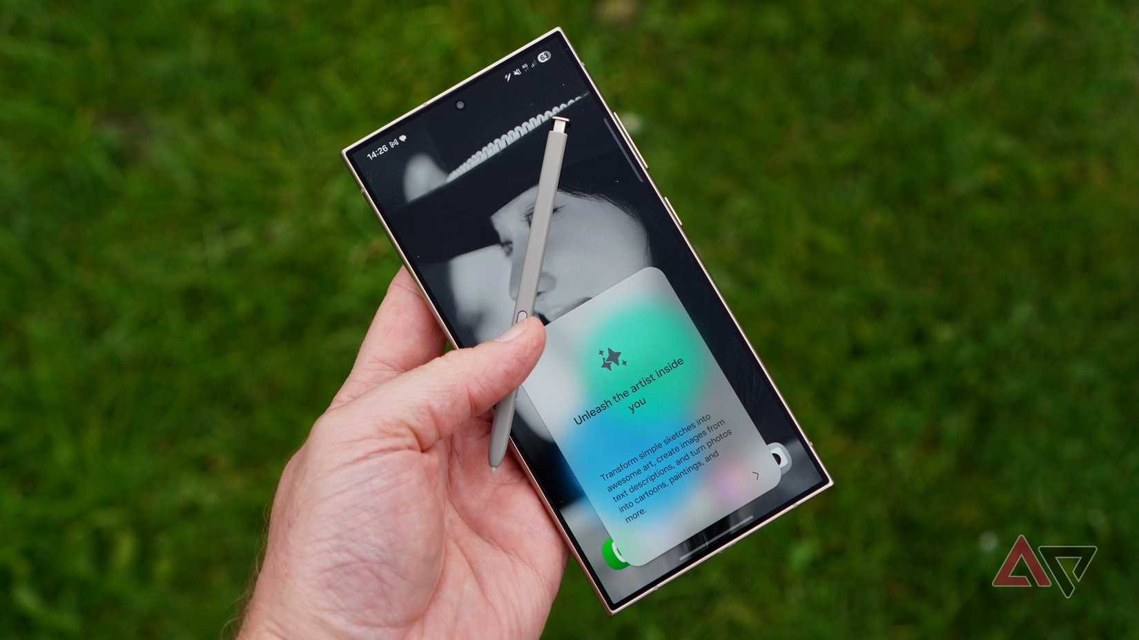 A person holding the Samsung Galaxy S24 Ultra and S Pen