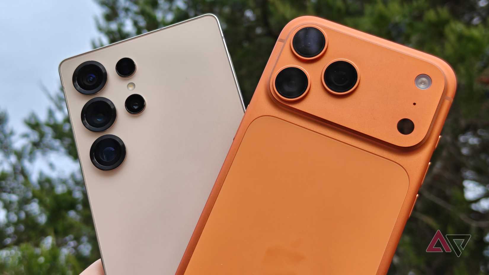 Samsung Galaxy S25 Ultra held up next to an iPhone 17 Pro Max