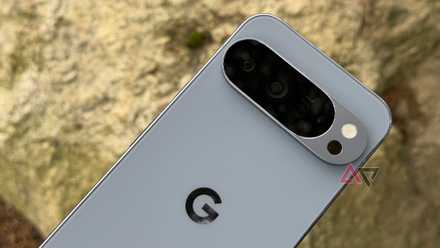 Google Pixel 10 Pro XL held up against brown rock