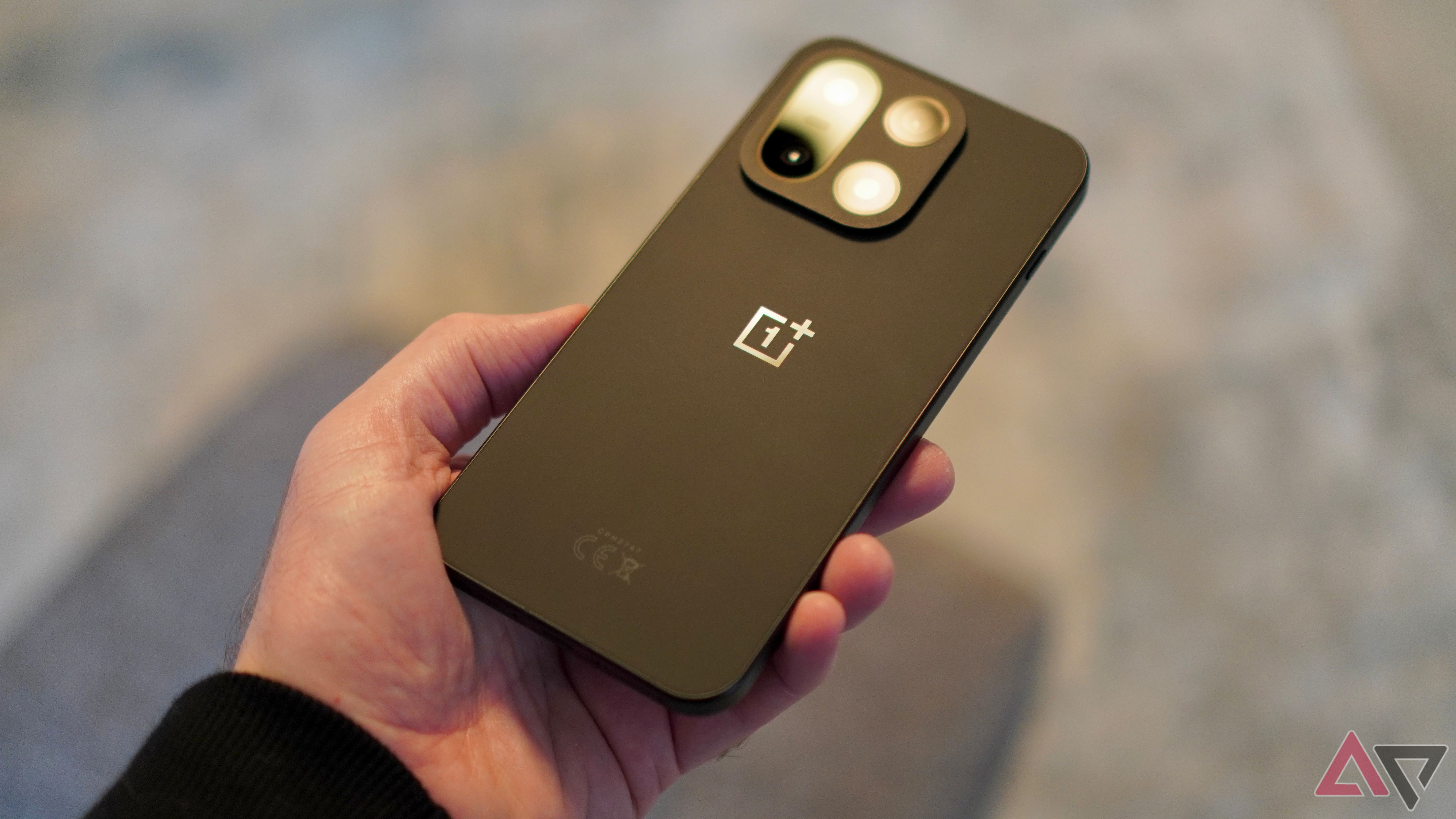 A person holding the OnePlus 15