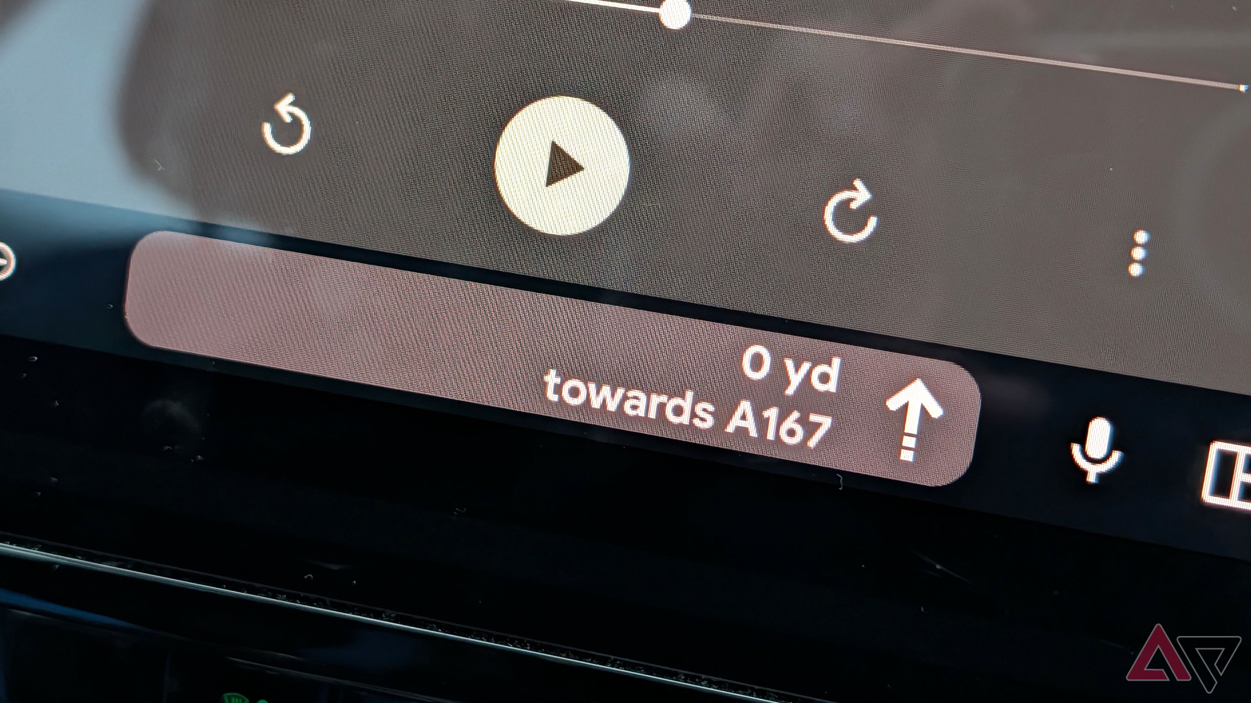 A close-up of Android Auto's taskbar widget for Google Maps navigation.