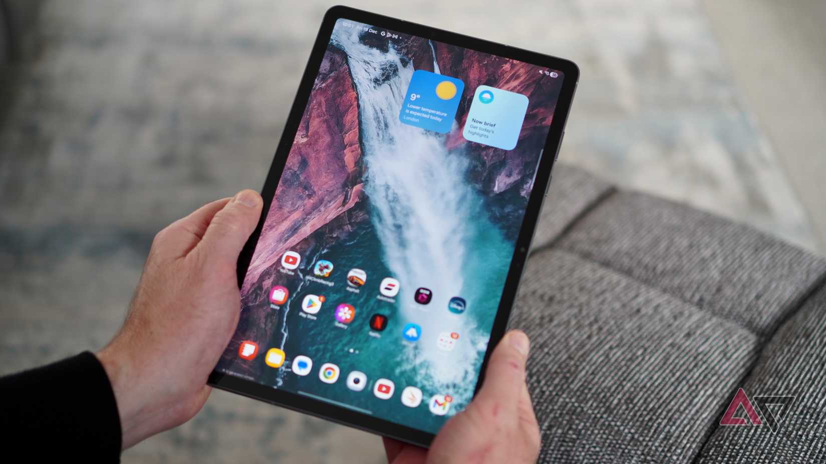 A person holding the Samsung Galaxy Tab S11