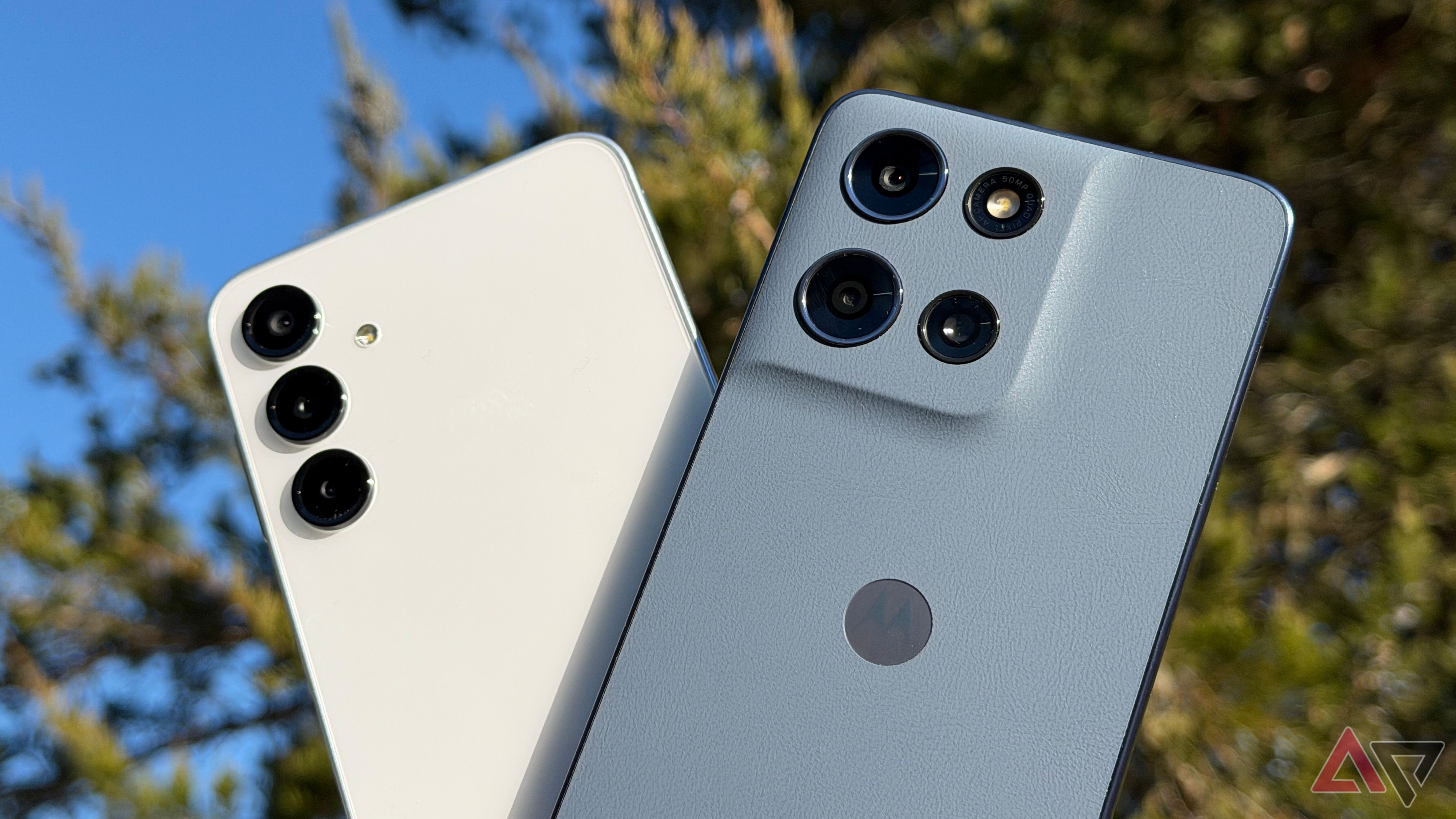 Moto G 2026 and Samsung Galaxy A16 held up against a sunny background