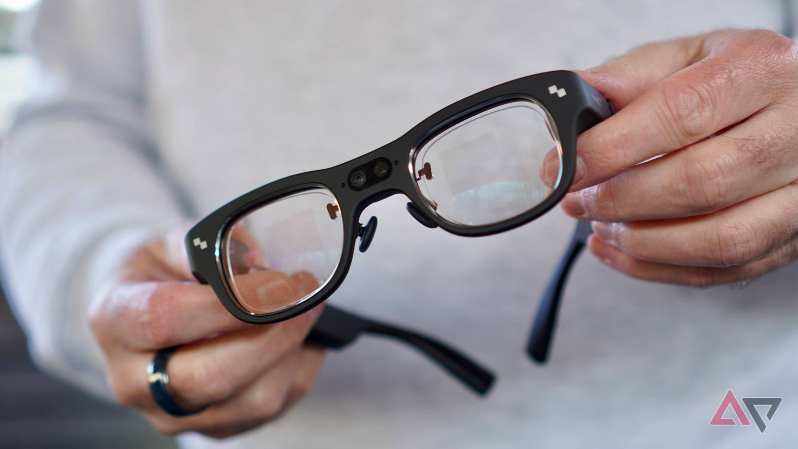 A person holding the RayNeo X3 Pro