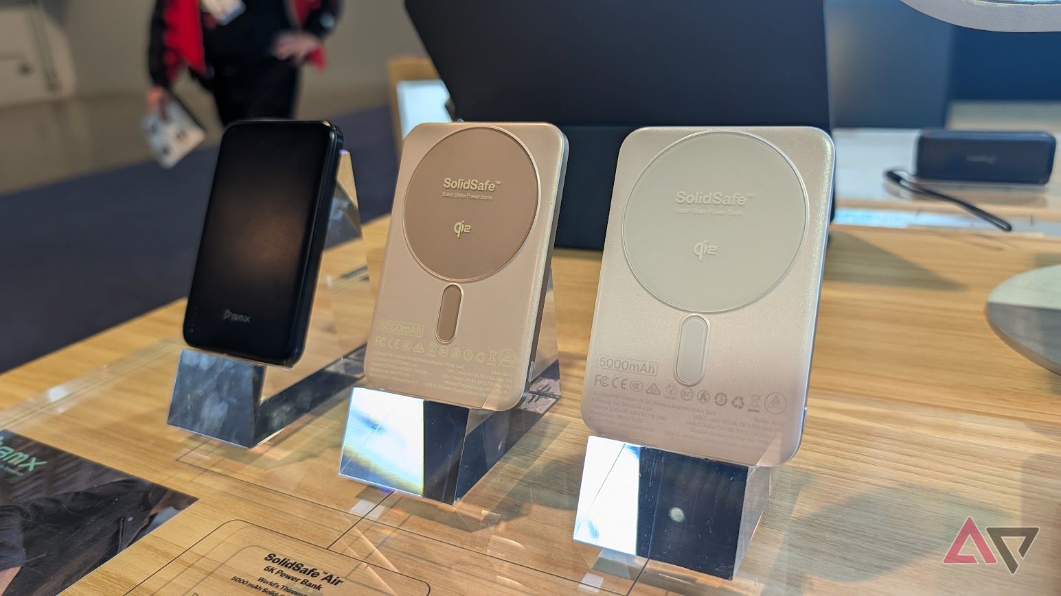 three power banks on metal stands