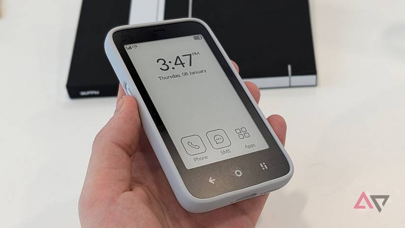 black and white e-paper smartphone showing time and apps