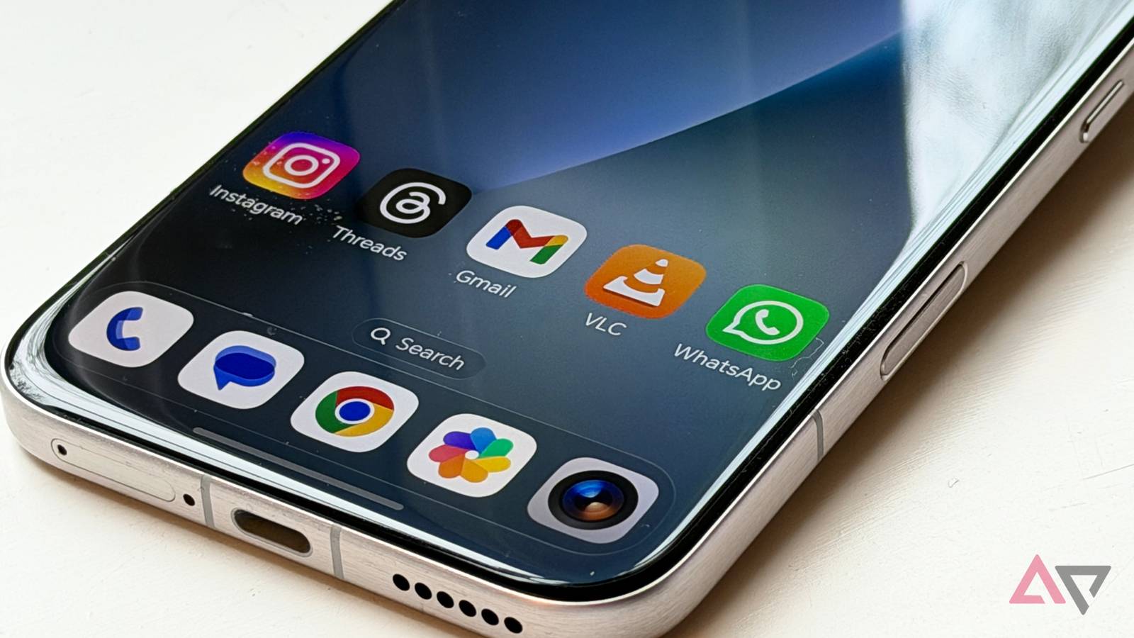 The VLC app icon on a phone Home screen