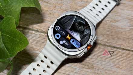 Samsung Galaxy Watch Ultra with a black cat on the home screen