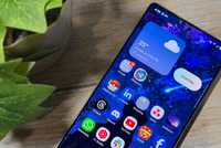 Samsung Galaxy S25 Ultra sitting next to green plant