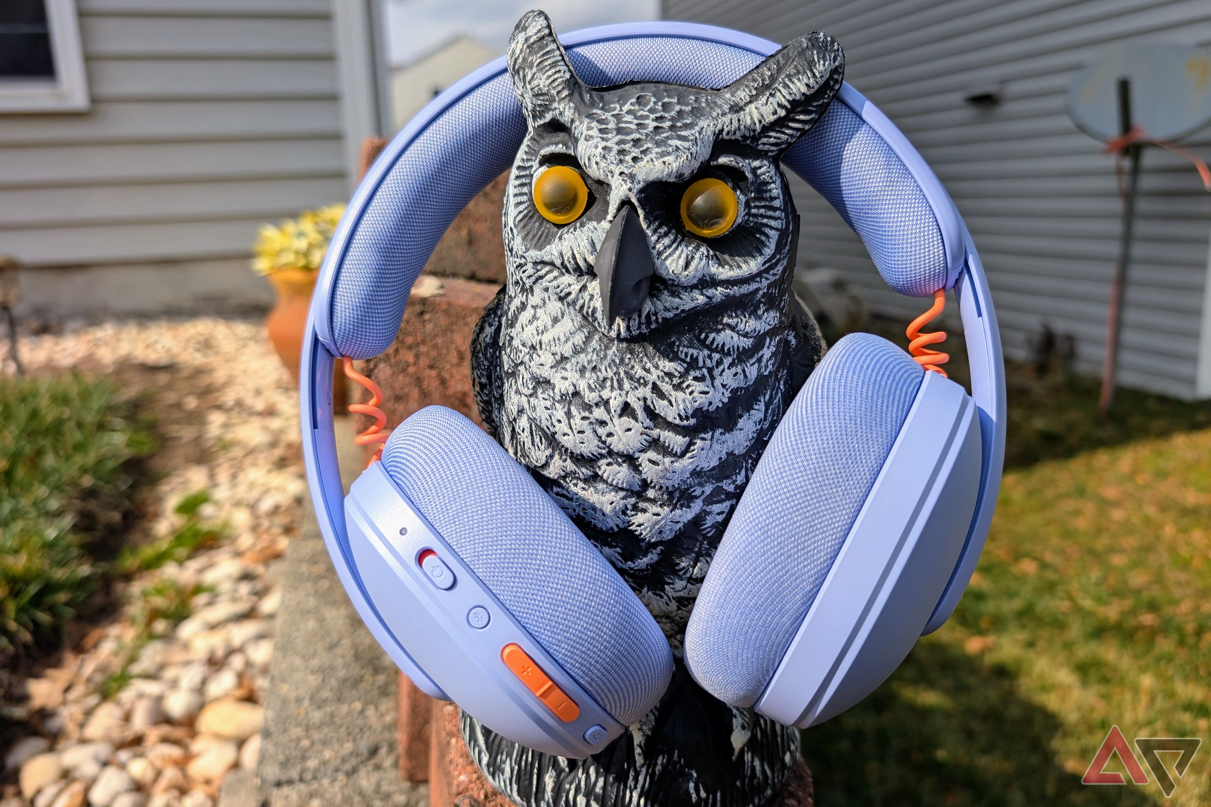 Logitech G325 Lightspeed headphones on an owl