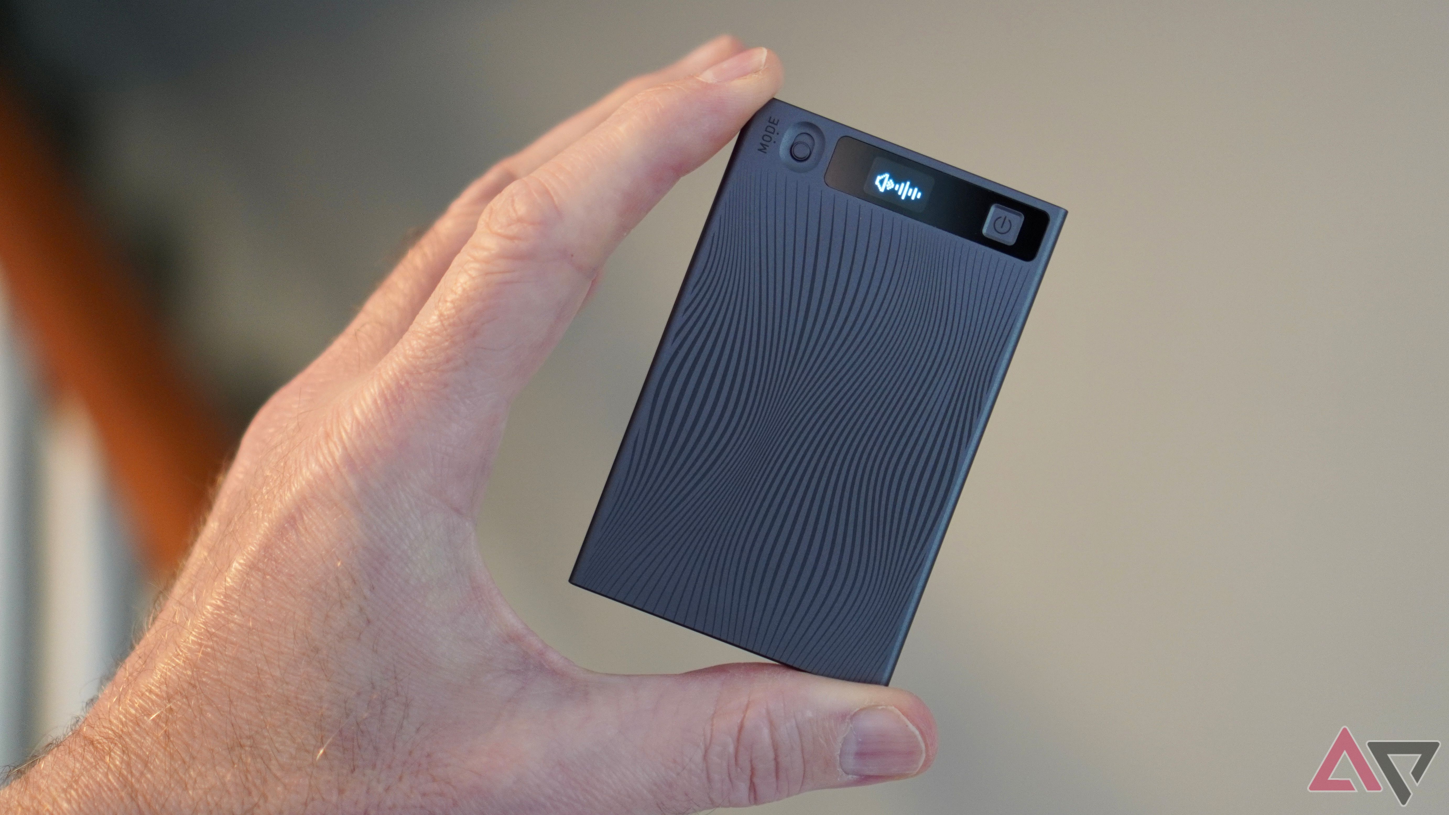 A person holding the Mobvoi TicNote