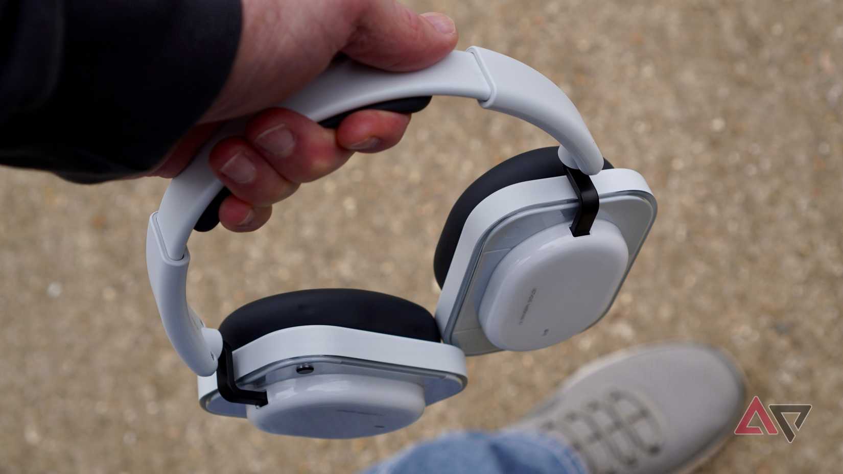 A person holding the Nothing Headphone (a)