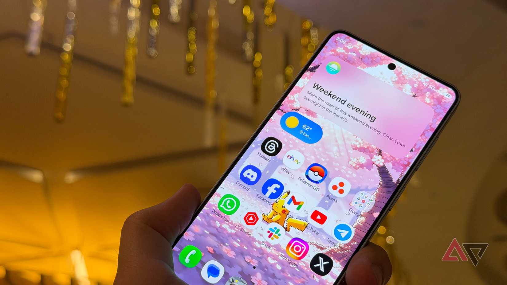 Samsung Galaxy S26 display against a mall ceiling