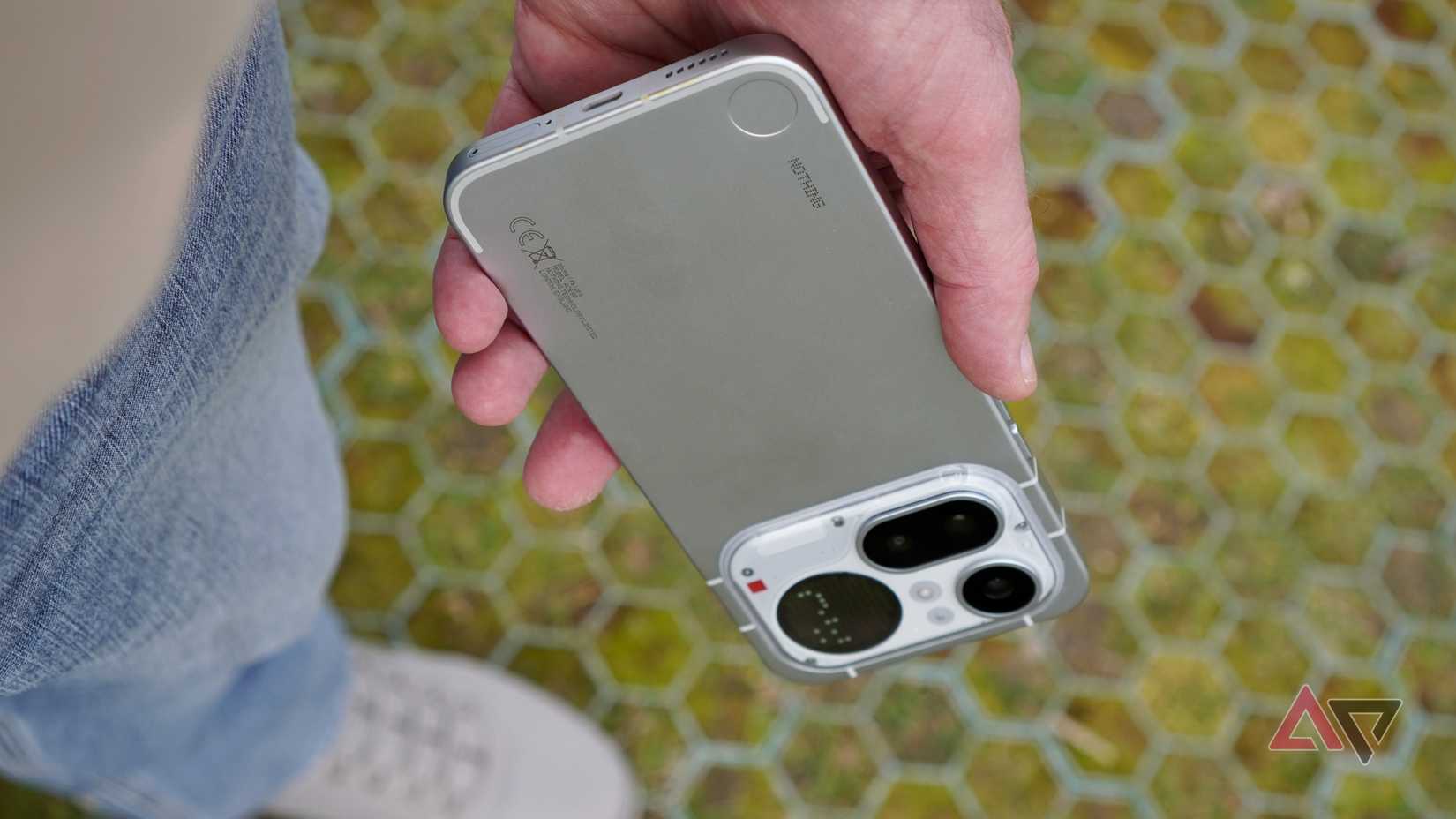 A person holding the Nothing Phone (4a) Pro