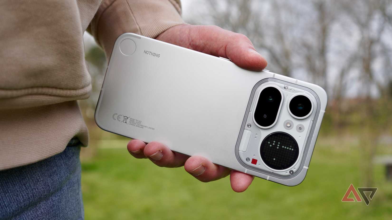 A person holding the Nothing Phone (4a) Pro