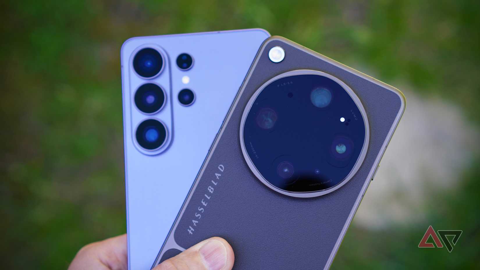 A person holding the Oppo Find X9 Ultra and Samsung Galaxy S26 Ultra