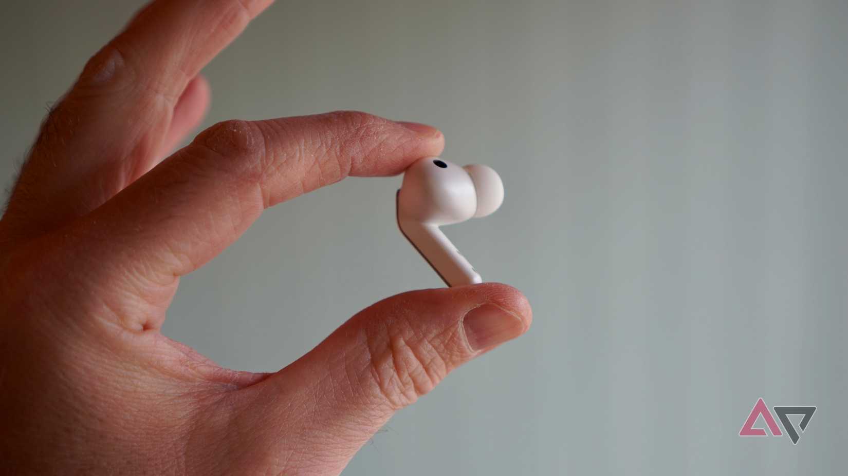A person holding the Samsung Galaxy Buds 4 Pro