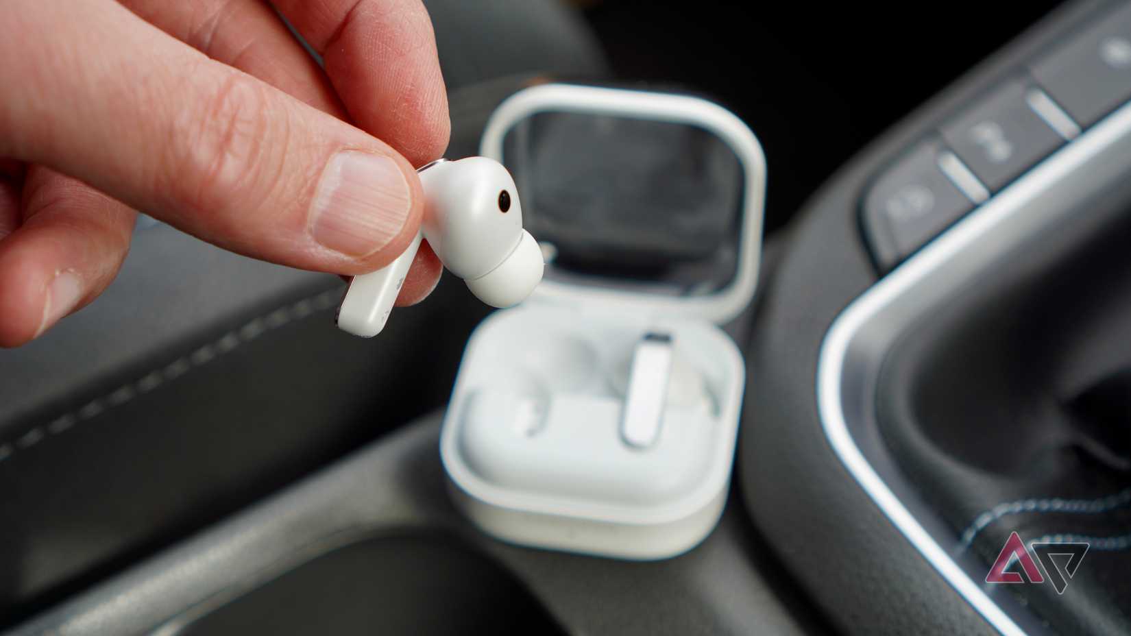 A person holding the Samsung Galaxy Buds 4 Pro earbud