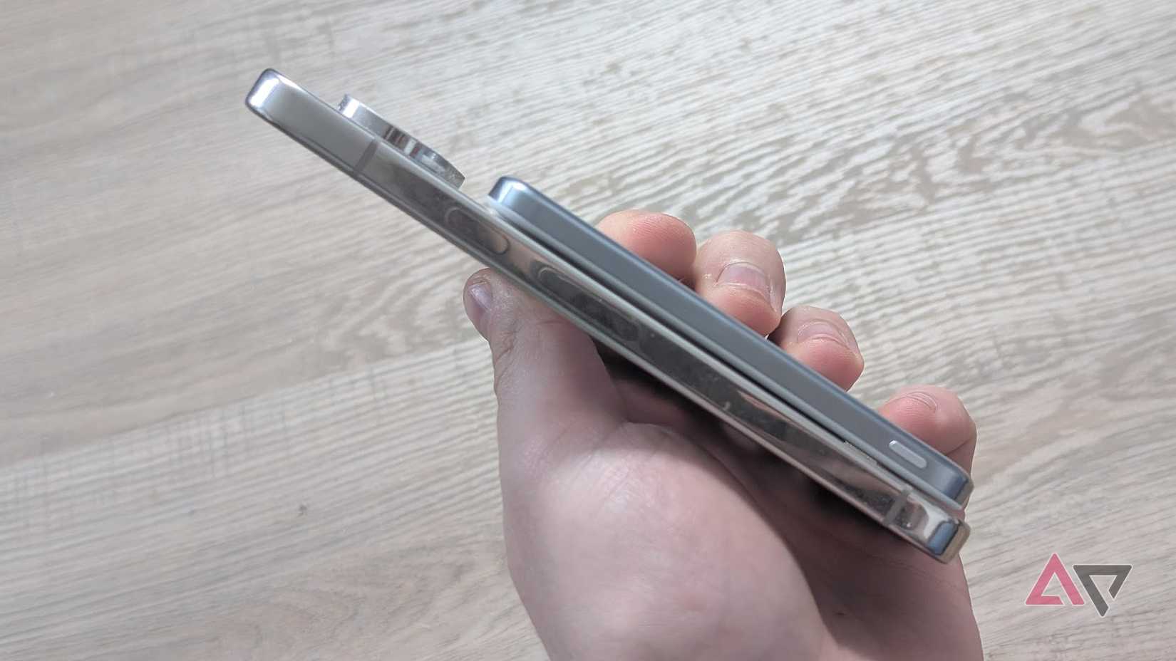 silver power bank attached to phone