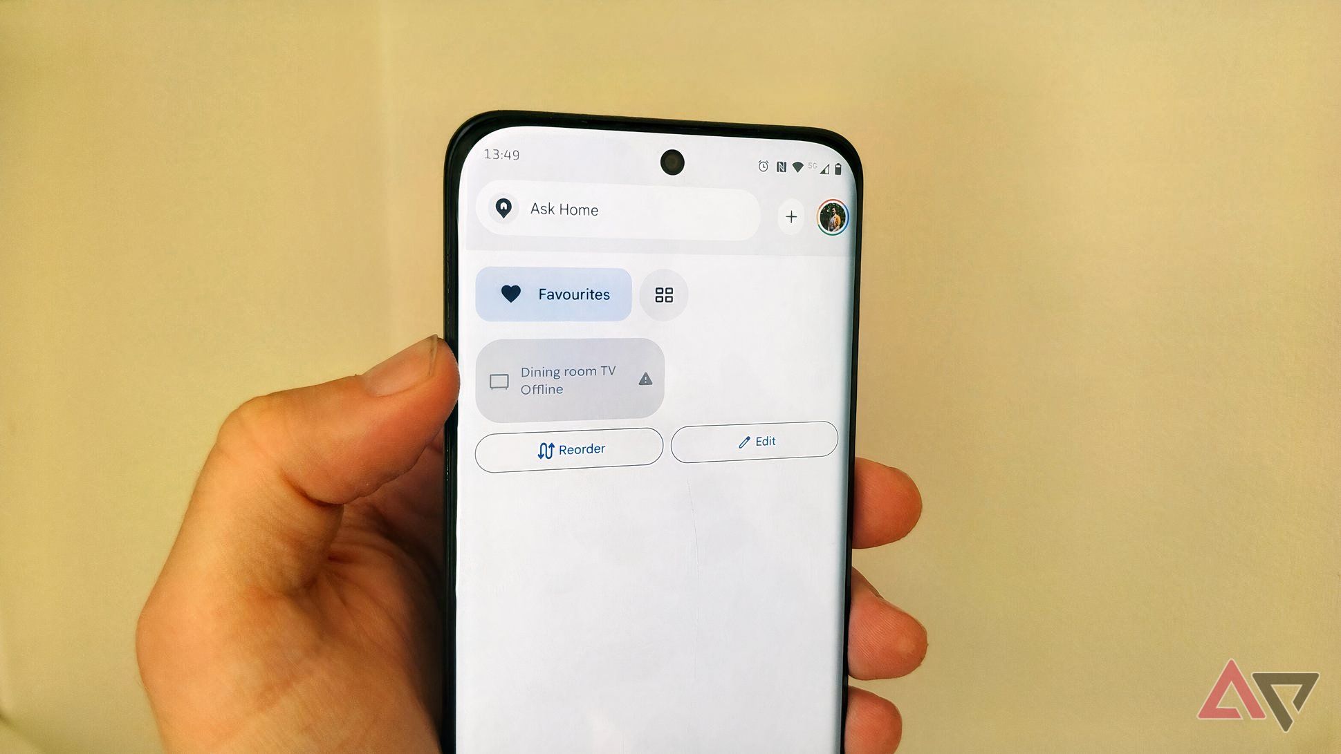 A Motorola phone showing a disconnected Dining room TV in Google Home.