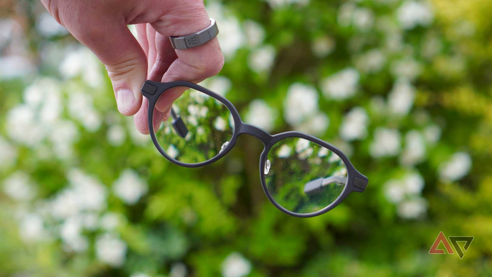 A person holding the Even Realities G2 smartglasses