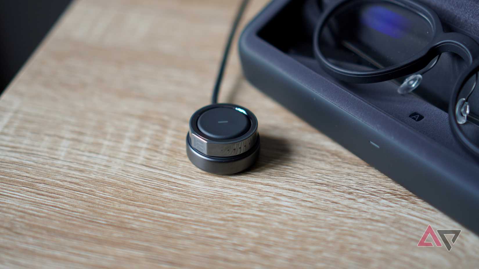 The Even Realities R1 smart ring on charge