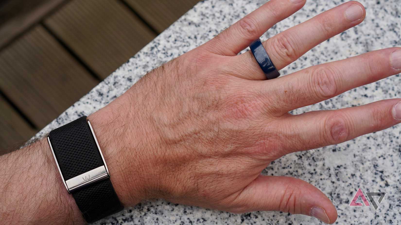 A person wearing the Oura Ring and Whoop activity trackers