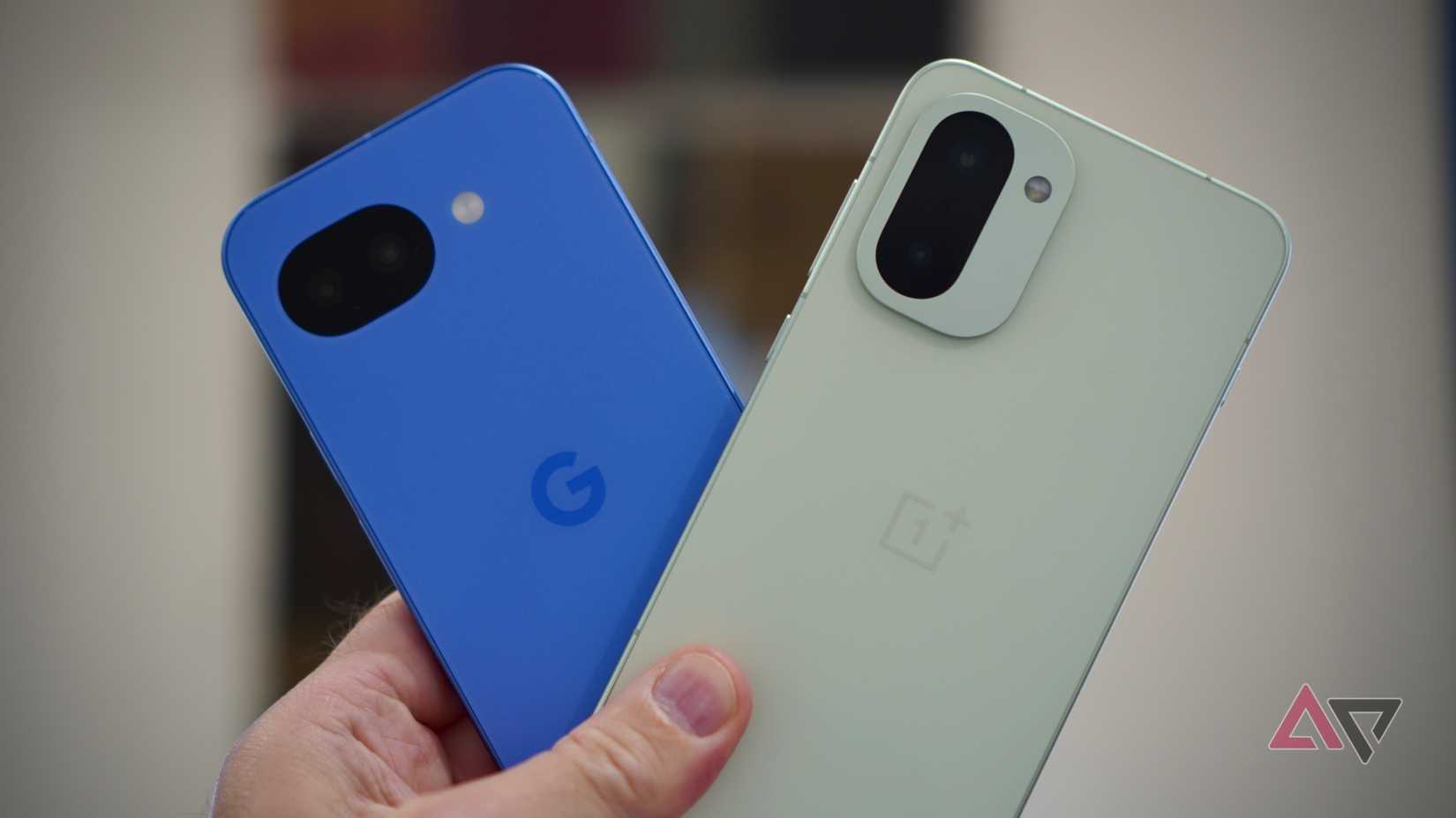 A person holding the Google Pixel 10a and OnePlus 15R